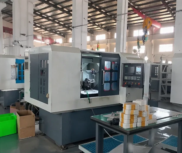 Sureay CNC machining center — blade workpieces on machine table