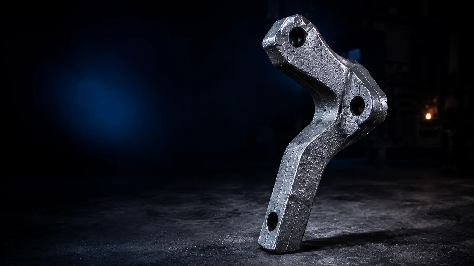 Cast steel mixing arm for concrete and asphalt mixers in a foundry setting