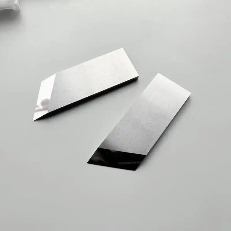 Pair of carbide box slotting knives showing the ground grooving bevel