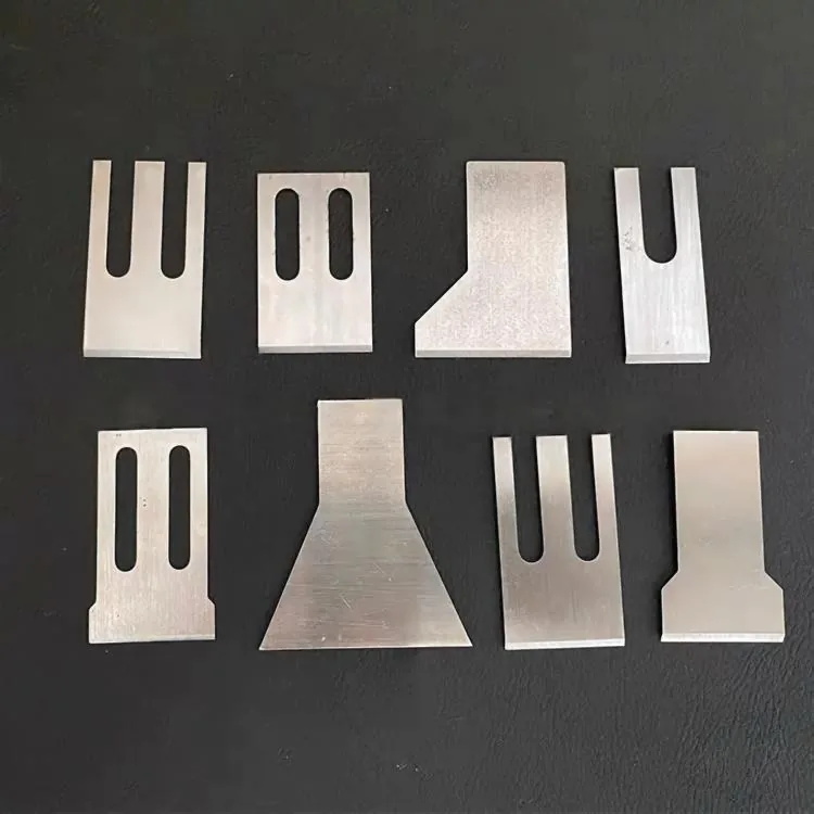 Eight underwater pelletizer blade profiles laid out for dimensional inspection