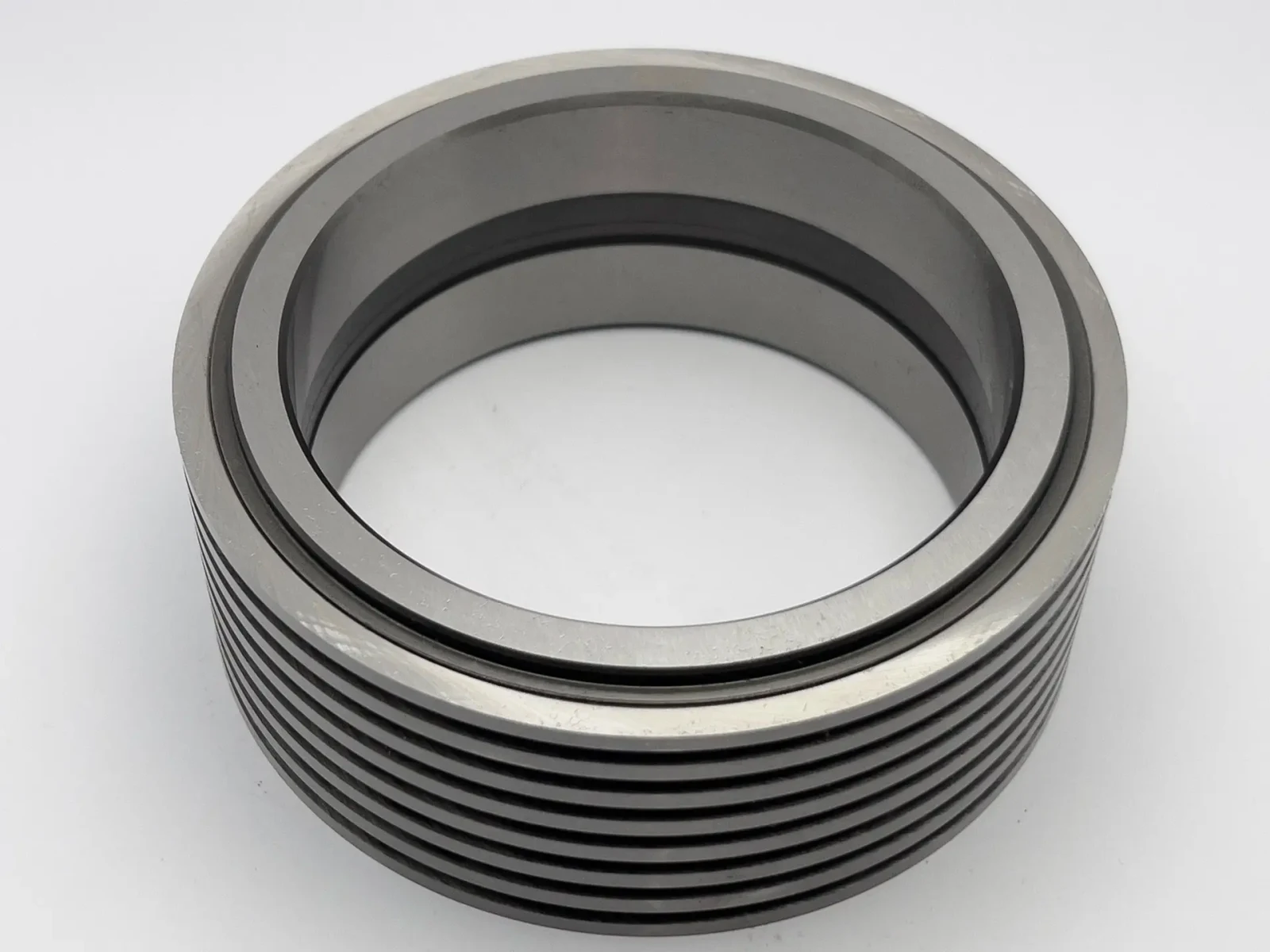 Multi-groove bottom cutter ring showing groove pitch and ground bore