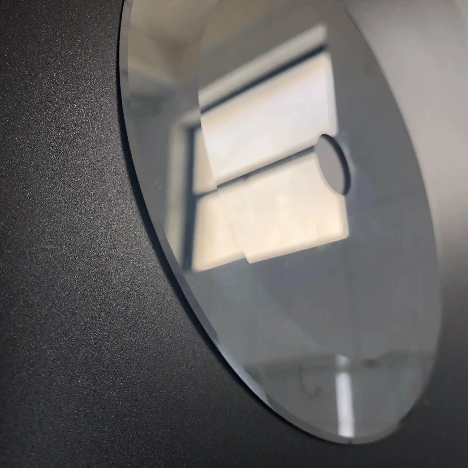 Close-up of the mirror-finished face and cutting edge of a paper straw slitting blade
